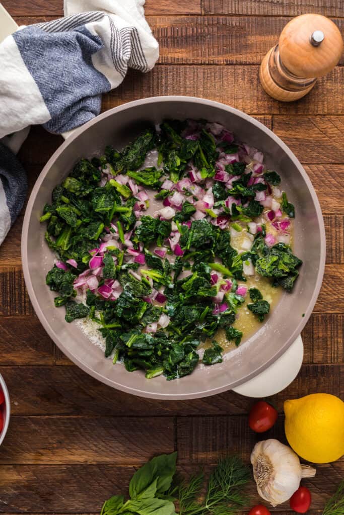 add frozen spinach to the skillet