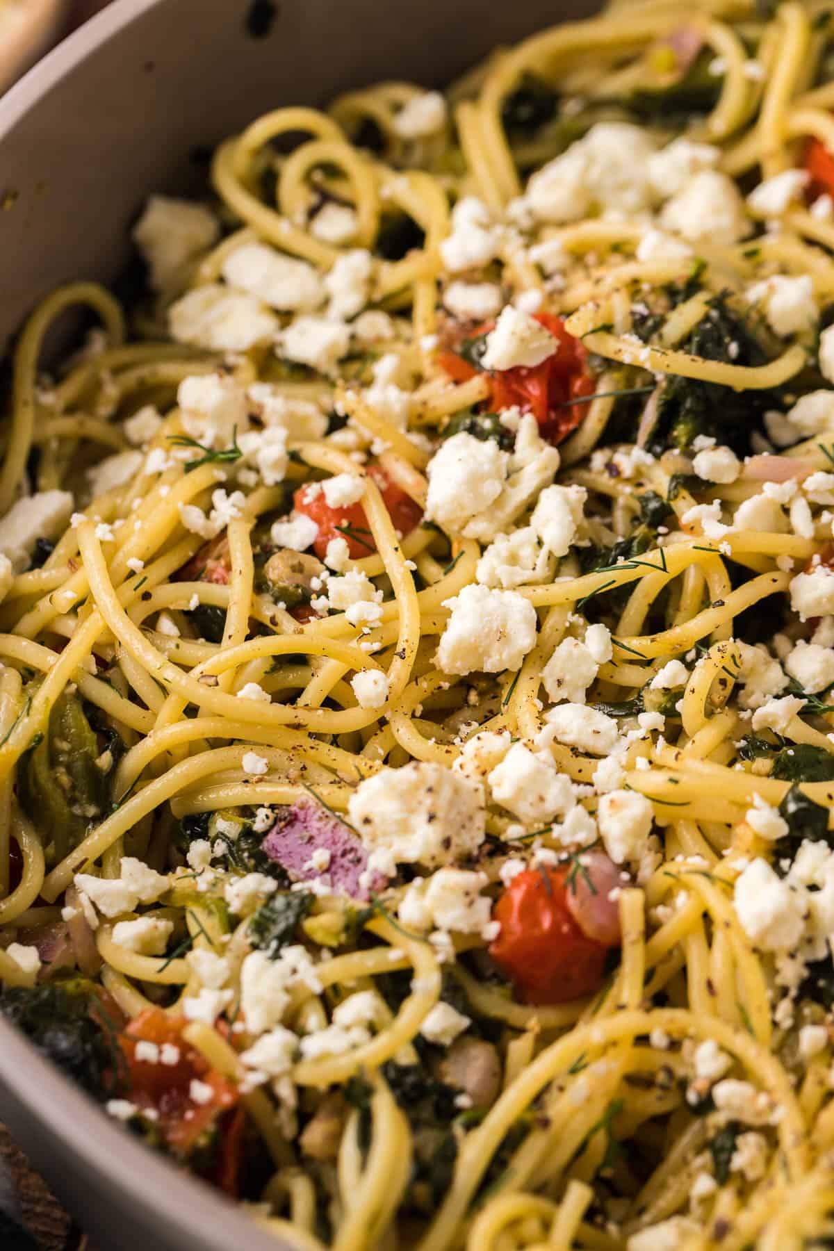 close up of pasta noodles with herbs and garlic