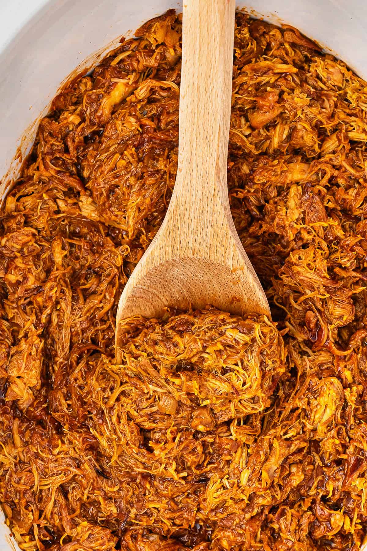 bbq chicken shredded in a slow cooker