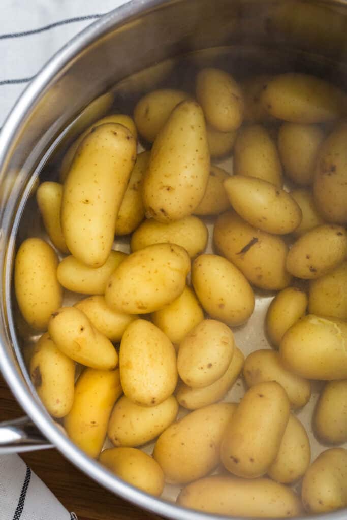 boiling creamer potatoes in a pot of water