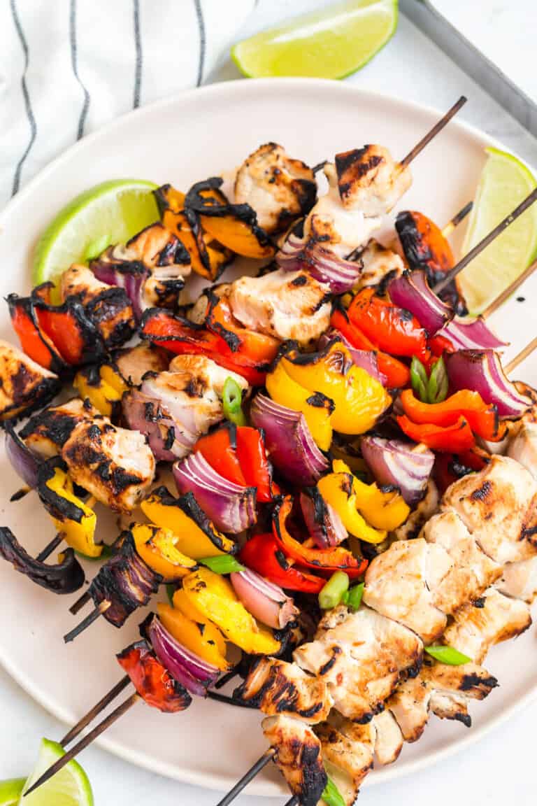 coconut lime chicken skewers on a plate fresh off the grill
