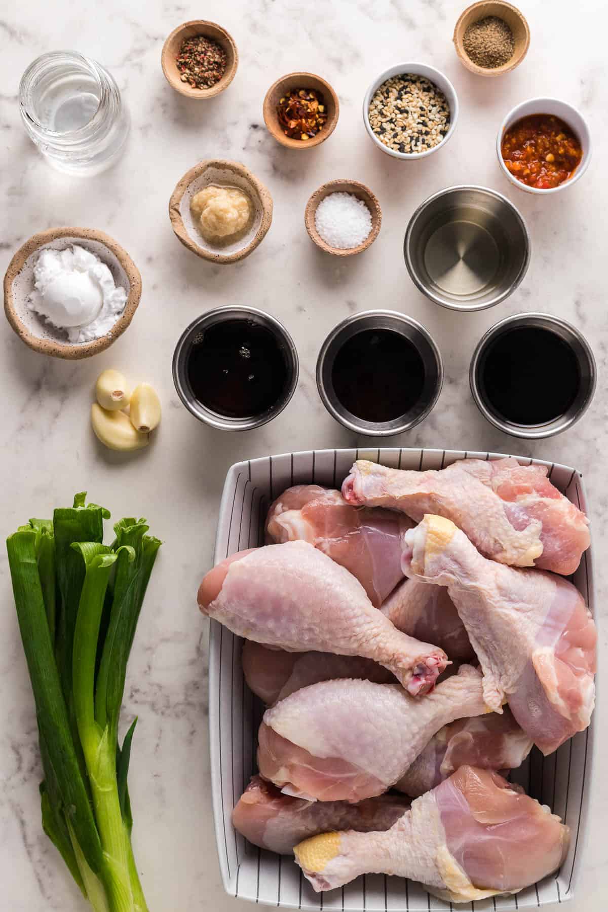 chicken drumsticks, and ingredients for a sesame sauce