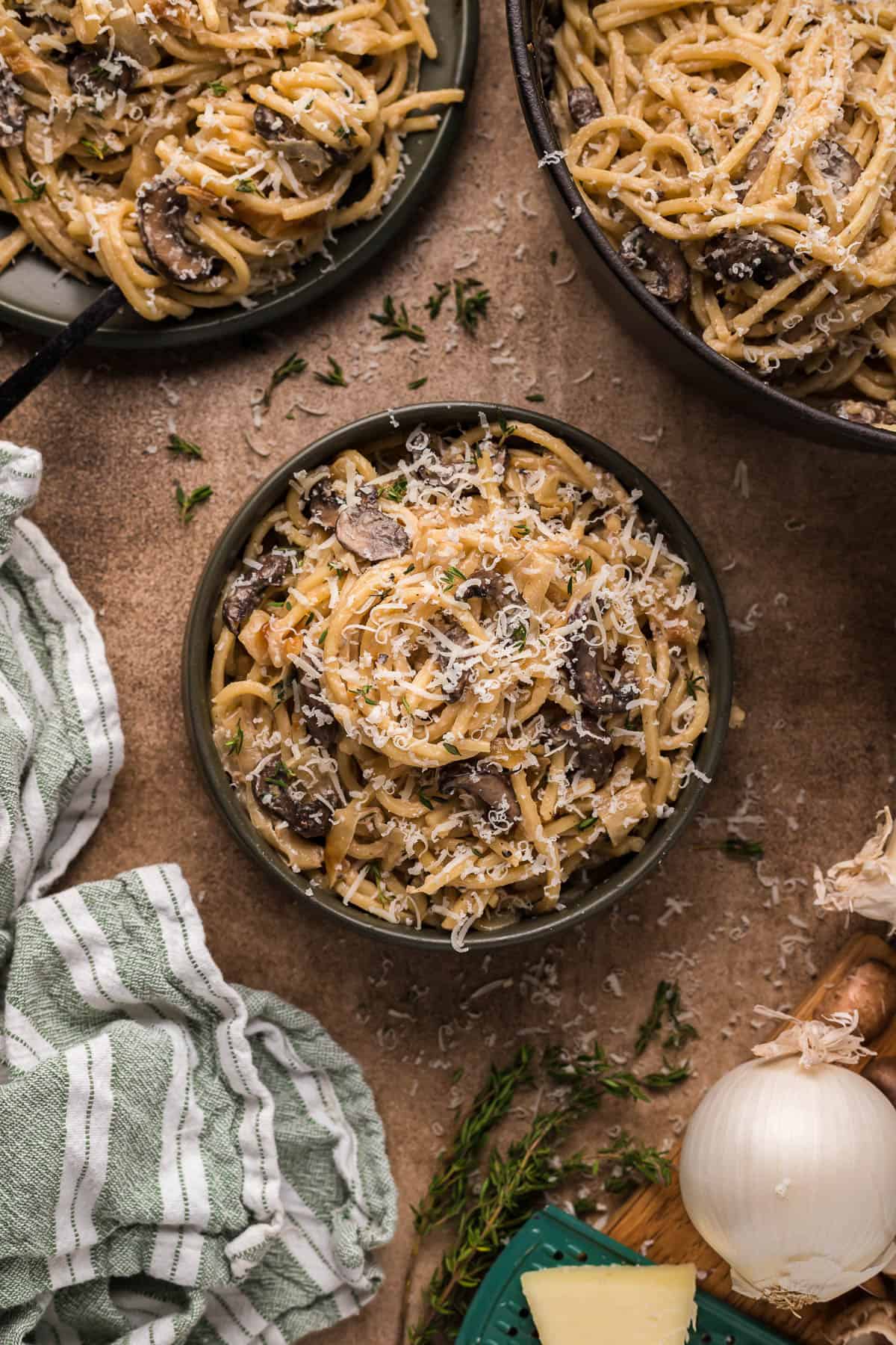 caramelized onion pasta in a black bowl