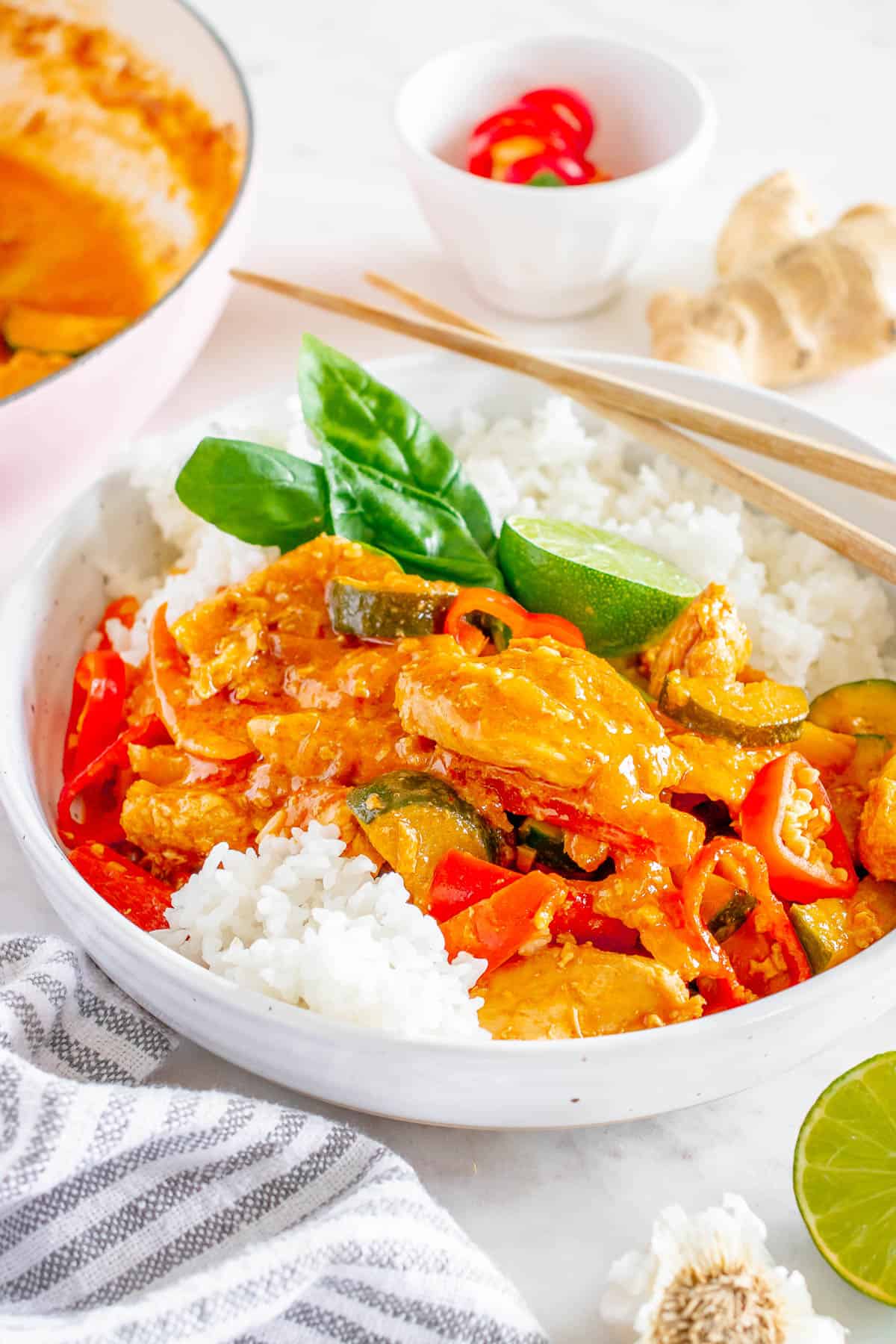 red thai curry chicken recipe with rice, basil, and lime