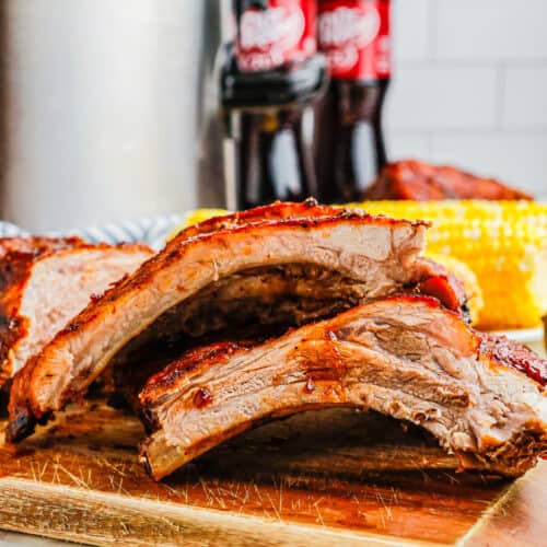 slow cooker dr. pepper baby back ribs on a cutting board