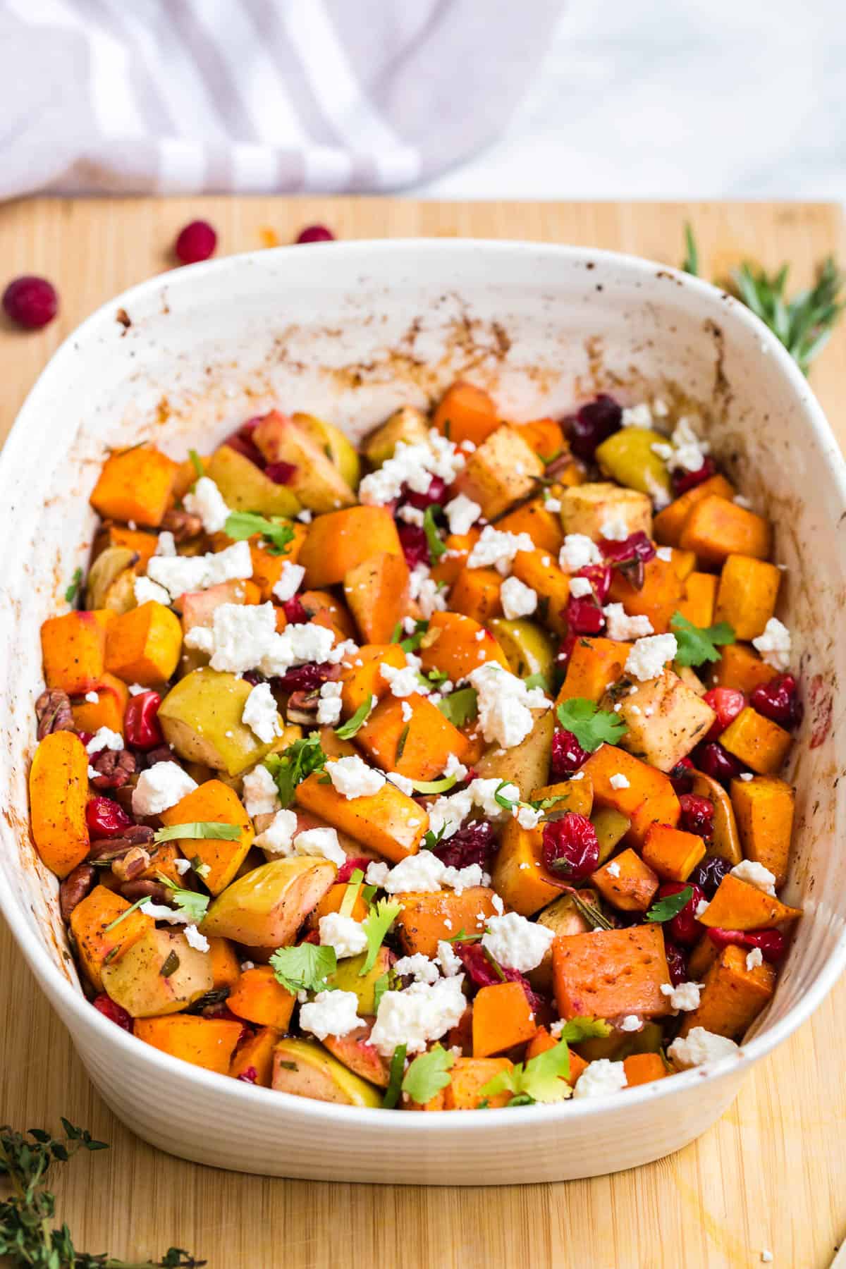 9 x 11.5 casserole dish with roast butternut squash, cranberries, apples and topped with feta cheese