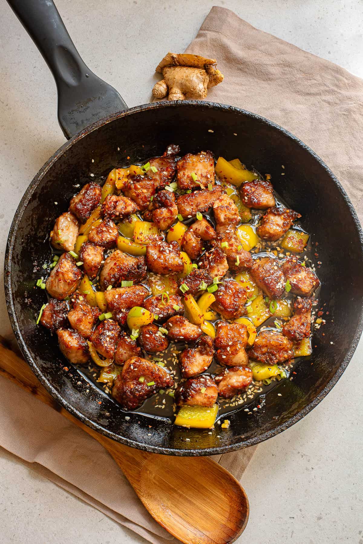 pork bites with a honey sauce with green onions and bell pepper