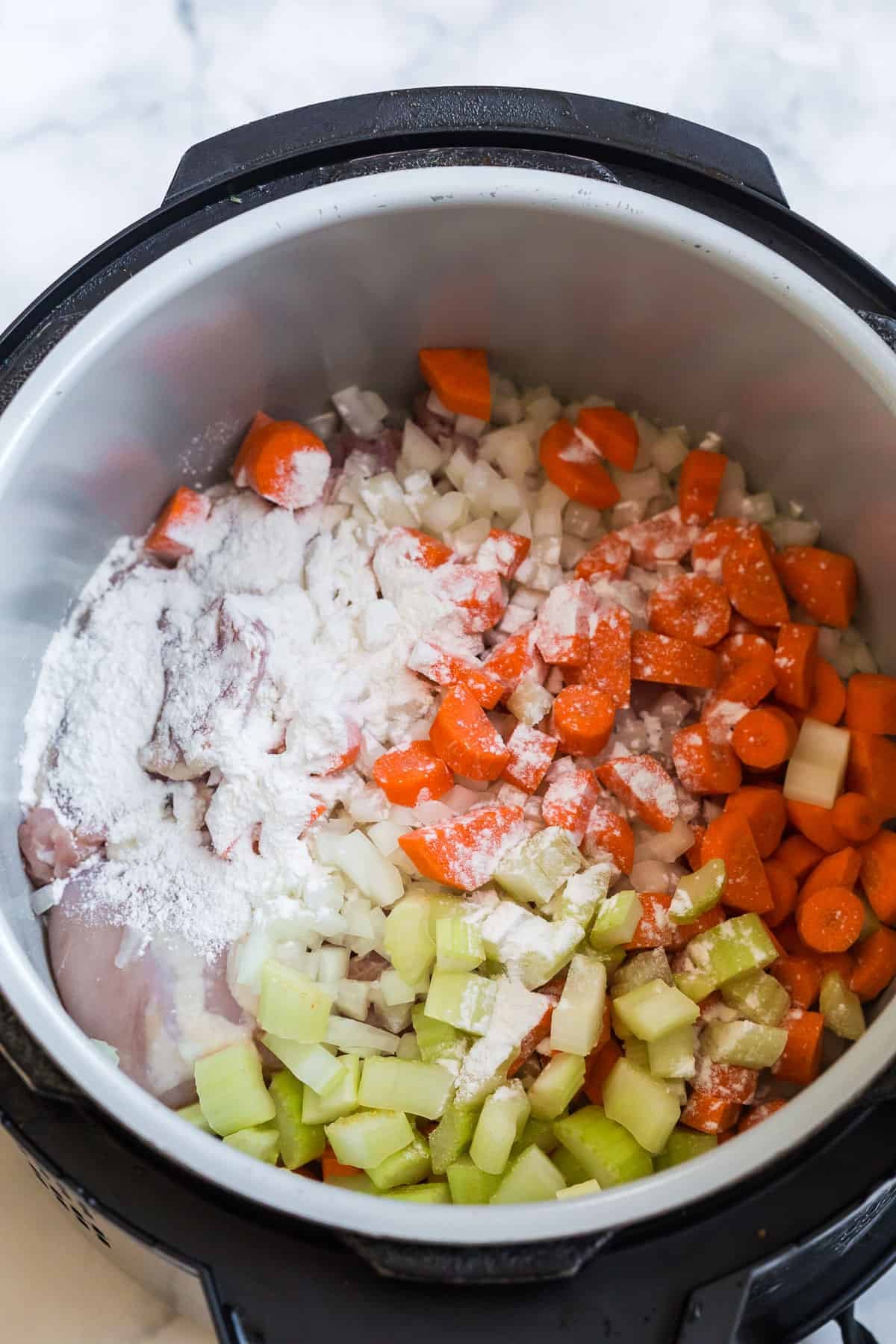all purpose flour with soup ingredients in a slow cooker